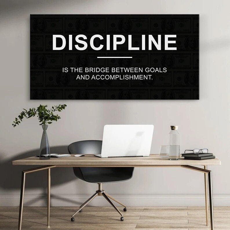 May include: Black and white motivational quote on a canvas print. The quote reads "Discipline is the bridge between goals and accomplishment."