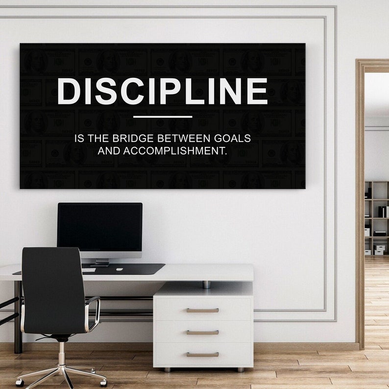 May include: Black and white motivational quote on a canvas print. The quote reads "DISCIPLINE IS THE BRIDGE BETWEEN GOALS AND ACCOMPLISHMENT."