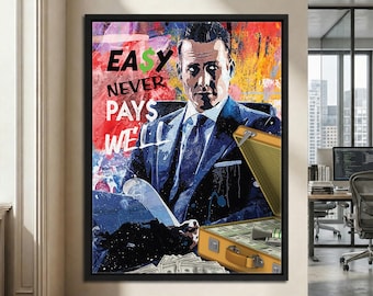 May include: A framed wall art print featuring a stylized portrait of a man in a suit with the text EASY NEVER PAYS WELL. The artwork includes a briefcase filled with stacks of cash, set against a vibrant, multi-colored abstract background.