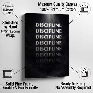 May include: A black canvas print with the word "DISCIPLINE" repeated in a vertical pattern. The canvas is stretched by hand and has a depth of 0.75 inches (1.90cm). The canvas is made of 100% premium cotton and is ready to hang.