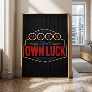 Peut inclure: Une affiche murale rectangulaire sur fond de bois noir avec un emblème graphique central. Le design présente le texte "MAKE" dans des cercles rouges, "Your" en écriture bleue, et "OWN LUCK" en grandes lettres rouges avec des contours jaunes.
