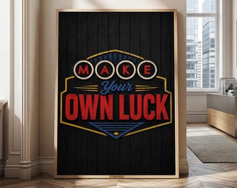 May include: A rectangular wall art print featuring a black wood-grain background with a central graphic emblem. The design includes the text "MAKE" in red circles, "Your" in blue script, and "OWN LUCK" in large red block letters with yellow outlines.