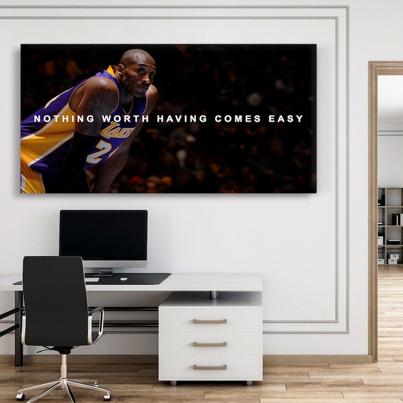 May include: A black and white motivational poster featuring a basketball player wearing a purple and gold jersey with the number 2 on it. The text on the poster reads "NOTHING WORTH HAVING COMES EASY".