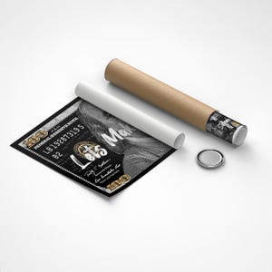 May include: A black and white poster with a $100 bill design featuring a portrait of Benjamin Franklin. The text "Let's Make" is written in gold lettering on the bill. The poster is rolled up and ready to be shipped.