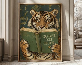 May include: Framed art print featuring a tiger reading a book with the text "GO GET 'EM TIGER". The tiger is depicted with orange and black stripes, holding a green book against a teal background with a gold frame.