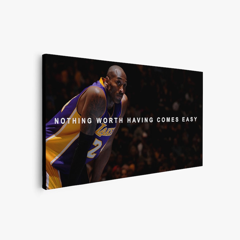 May include: A basketball player wearing a purple and gold jersey with the number 2 on it. The player is looking to the right and the text "NOTHING WORTH HAVING COMES EASY" is printed on the image.