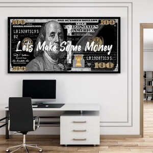 May include: A black and white image of a $100 bill with gold accents. The bill is partially obscured by a gold Liberty Bell. The text "Lets Make Some Money" is written in gold letters across the bill.