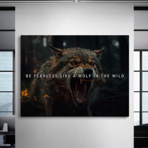 May include: A black and white motivational poster featuring a wolf with its mouth open, snarling. The text on the poster reads "BE FEARLESS LIKE A WOLF IN THE WILD."