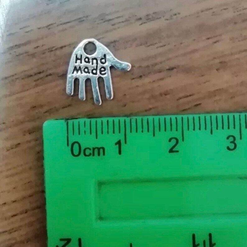 Hand made silver metal charms pack of 20