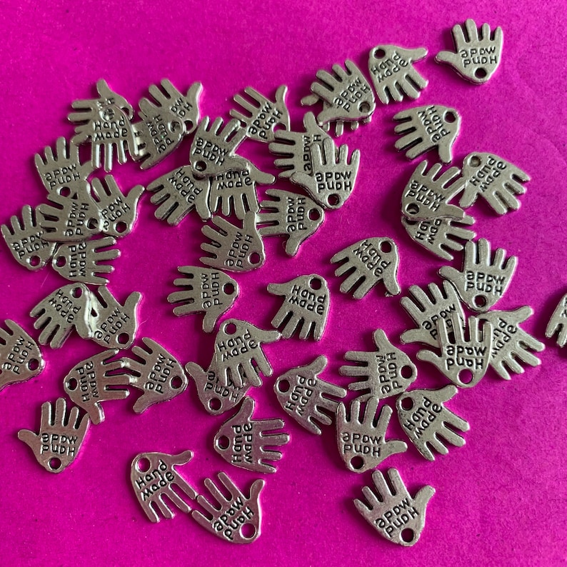 Hand made silver metal charms pack of 20