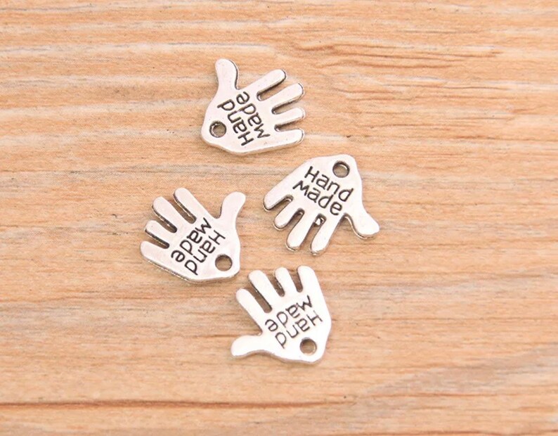Hand made silver metal charms pack of 20