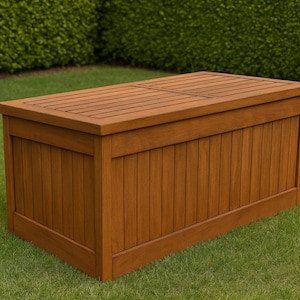 May include: A brown wooden storage chest with a slatted lid and vertical panels. The chest is rectangular and sits on a green lawn. The design suggests it is for outdoor storage, perhaps for garden items.
