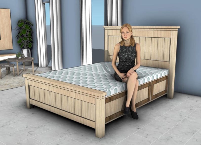 May include: A light-colored wooden bed frame with a headboard and footboard. The bed has a patterned mattress and a person is sitting on the edge of the bed. The room has blue walls and a window with white curtains.