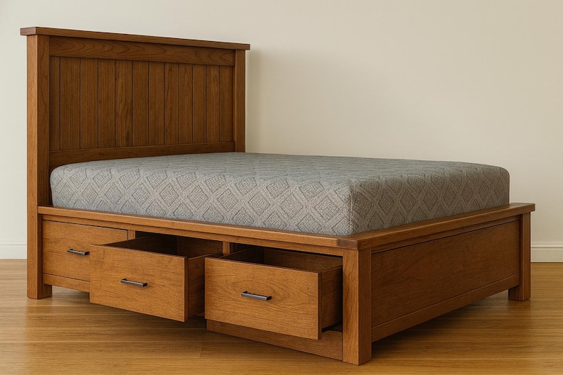 May include: A wooden bed frame with a headboard and built-in drawers. The bed frame is made of a light brown wood and has a gray patterned mattress. The drawers have metal handles.