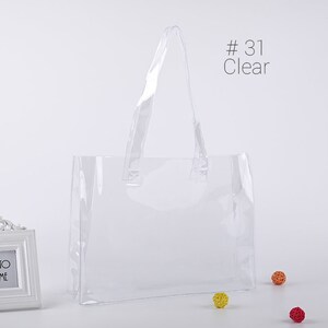 May include: Clear plastic tote bag with a handle. #31 Clear