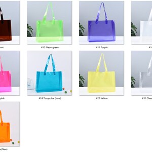May include: A set of 13 clear plastic tote bags in various colors, including blue, brown, green, purple, white, mint, black, hot pink, turquoise, yellow, clear, jelly pink, and peach. Each bag has a handle and is made of a clear plastic material.