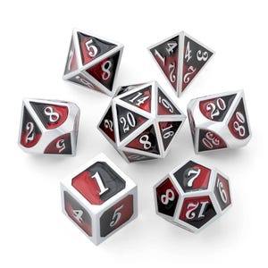 May include: A set of seven polyhedral dice for tabletop games. Each die features a silver frame with black and red faces, displaying white numbers. The dice include a D4, D6, D8, D10, D12, D20, and a percentile die.