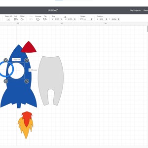 May include: A blue rocket ship with a red nose cone and an orange flame. The rocket ship is 3.75 cm tall and 1.75 cm wide. The rocket ship is on a white background.