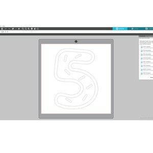 May include: A white outline of the number 5 with a donut-like design. The number is on a white background.