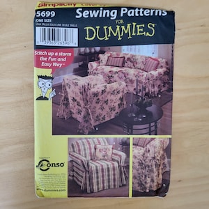 May include: Simplicity sewing pattern for dummies. The cover features a floral sofa and chair slipcover design. The pattern includes the text "Stitch up a storm the Fun and Easy Way". The pattern number is 5699.