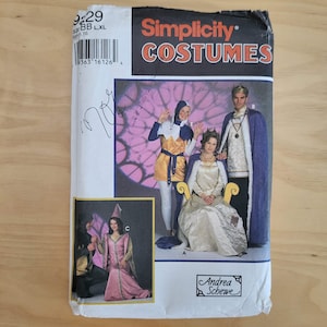 May include: A Simplicity Costumes sewing pattern envelope featuring illustrations of medieval-style outfits. The package displays a jester costume, a long gown with a cape, and a tunic with a cloak. Text includes Simplicity Costumes and Andrea Schewe.