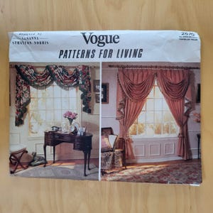 May include: Vogue Patterns for Living sewing pattern. The cover features images of window treatments, including floral valances and draped curtains. The pattern is designed by Susanna Stratton-Norris.
