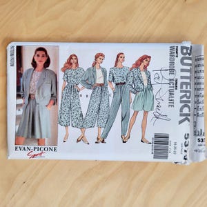 May include: A vintage Butterick sewing pattern featuring illustrations of women's suits and separates. The pattern includes a blazer, shorts, and pants. The brand name "EVAN-PICONE Sport" is visible. The pattern is for sizes 18-20-22.