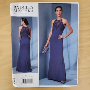 May include: A pattern for a Badgley Mischka formal gown. The design features a halter neckline with lace detailing and a fitted silhouette. The image shows the dress on a model, along with a smaller image of the dress from the back. The pattern is labeled V1615.