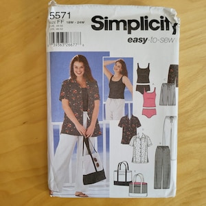 May include: A Simplicity 5571 easy-to-sew pattern envelope for size FF 18W-24W. The front displays illustrations of a floral print shirt, white trousers, a tank top, and a tote bag. It includes technical drawings of various garment options.