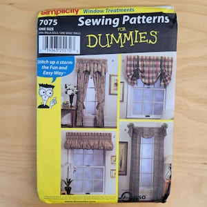 May include: A Simplicity sewing pattern for window treatments. The package features images of various curtain styles, including valances and drapes. The text includes "Sewing Patterns for Dummies" and "Stitch up a storm the Fun and Easy Way."