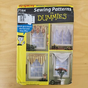 May include: A Simplicity sewing pattern for window treatments. The pattern features various curtain designs, including valances and drapes. The cover has the text "Sewing Patterns for Dummies" and "Stitch up a storm the Fun and Easy Way".
