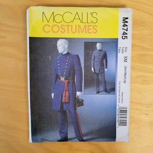 May include: A McCall's Costumes pattern envelope. The cover features a blue military-style uniform with gold buttons, a red sash, and matching pants. The text "McCall's Costumes" is in yellow. The size is XM (Sml-Med-Lrg).