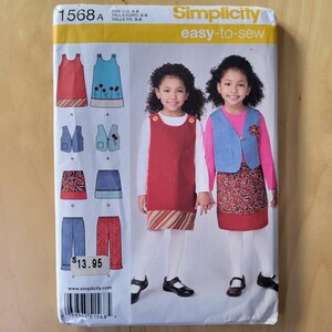 May include: Simplicity sewing pattern 1568A for girls' dresses, vests, skirts, and pants. The pattern includes illustrations of the finished garments and the text "easy-to-sew". The pattern size is U.S. 3-8.