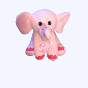 May include: A pink plush elephant toy with a small pink elephant design on its chest. The elephant has large ears and a long trunk.