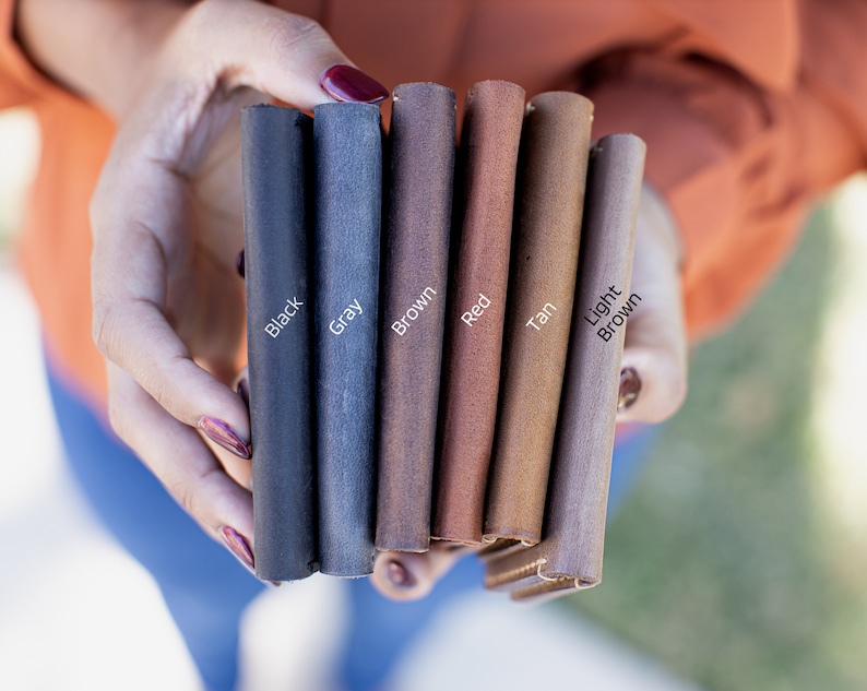 May include: Leather swatches in black, gray, brown, red, tan, and light brown.