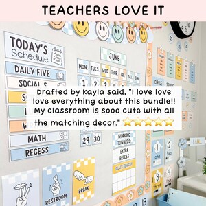 May include: A classroom wall display set featuring a Today's Schedule, a monthly calendar for June, and various educational posters with pastel checkered patterns. The decor includes smiley face cutouts, number charts, and labels for daily activities.