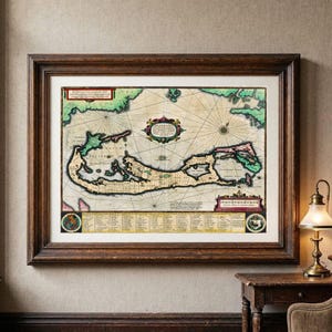 May include: A framed antique-style nautical map featuring a beige background with green landmasses, black navigational lines, and a central decorative cartouche. The print includes a detailed legend at the bottom and two circular emblems.