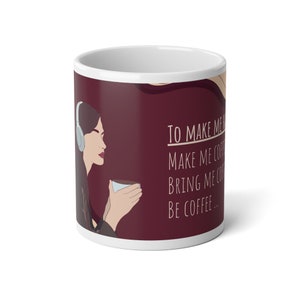 May include: White ceramic mug with a burgundy background featuring a woman with headphones holding a cup of coffee. The text on the mug reads "To make me happy, make me coffee, bring me coffee, be coffee..."