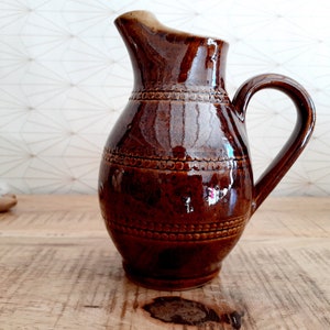 Small vintage enameled stoneware pitcher