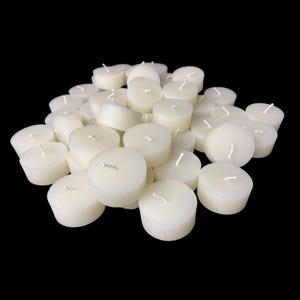 May include: A pile of white unscented tea light candles.