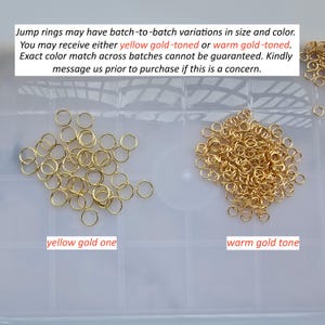 May include: A collection of gold-toned metal jump rings arranged in two separate piles. The left pile is labeled yellow gold one, and the right pile is labeled warm gold tone. The text states: Jump rings may have batch-to-batch variations in size and color.