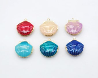May include: Six gold-tone seashell charms with different colored enamel finishes: red, pink, cream, blue, teal, and dark blue.