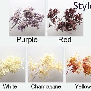 以下が含まれることがあります： 5本の異なる色の造花。色は紫、赤、白、シャンパン、黄色。枝はすべて同じスタイルで、小さく繊細な葉が付いています。画像の上部に「Style B」というテキストがあります。