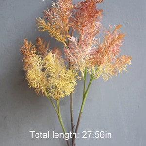 May include: Orange artificial flower stems with feathery foliage. The stems are approximately 27.56 inches long.