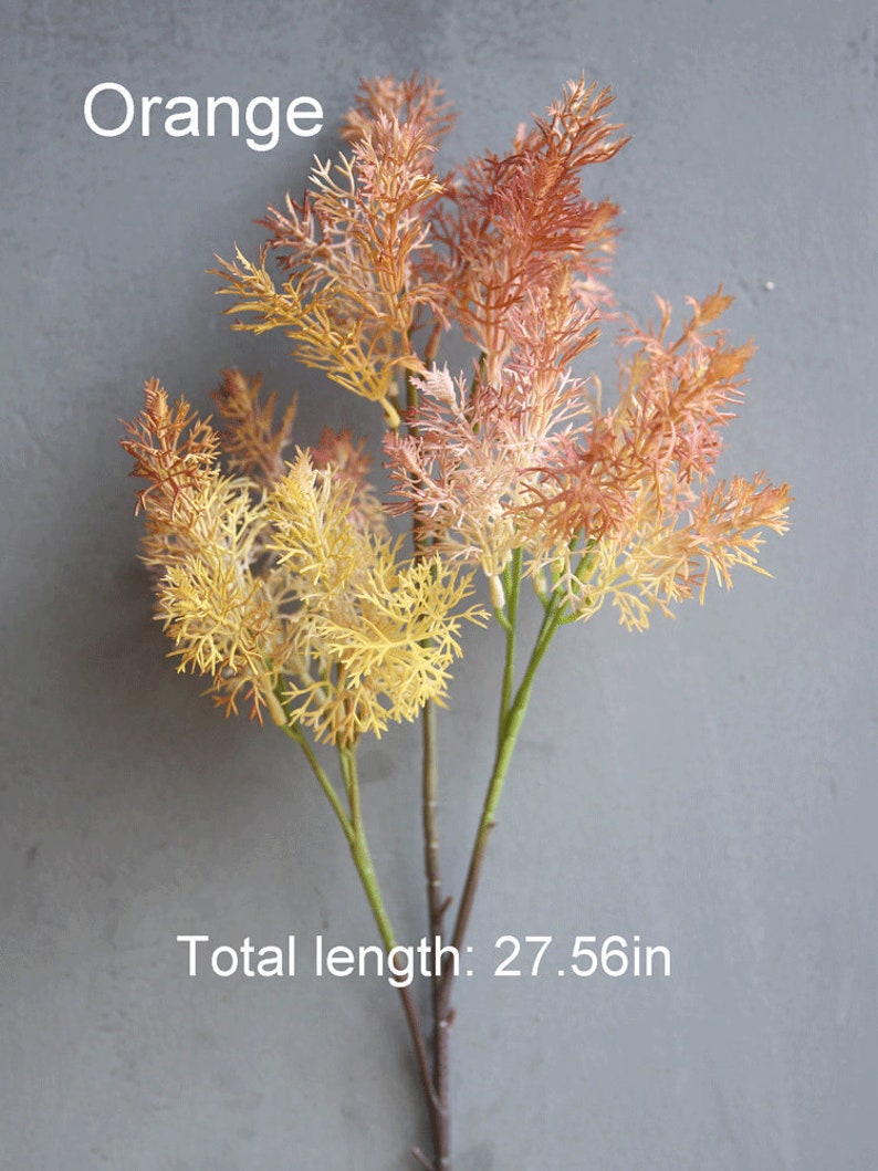 May include: Orange artificial flower stems with feathery foliage. The stems are approximately 27.56 inches long.