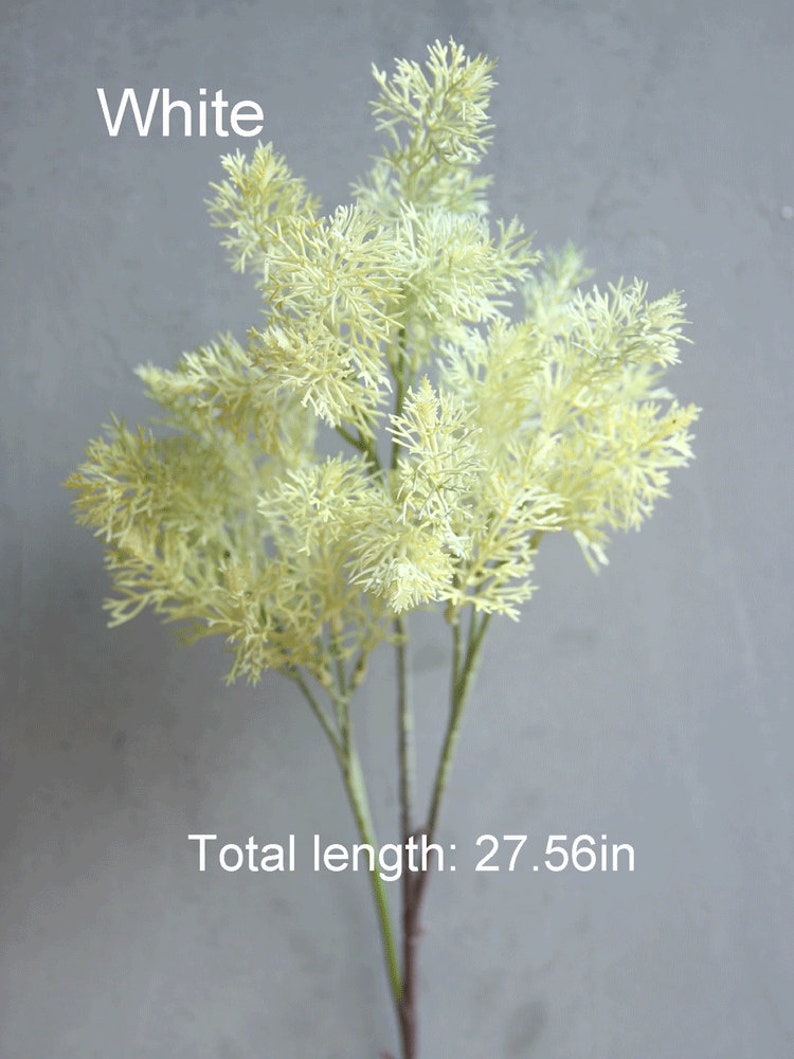 May include: White artificial greenery sprig with a feathery texture. The sprig is 27.56 inches long.