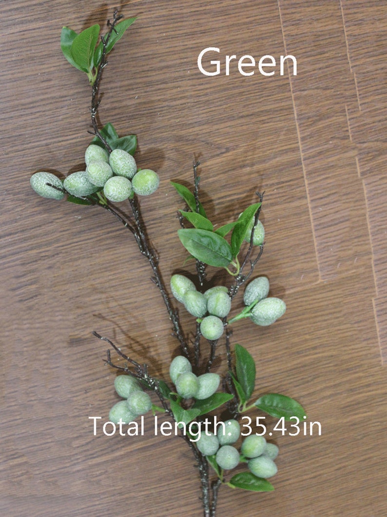 May include: Green artificial olive branch with leaves and frosted green olives. Total length: 35.43 in.
