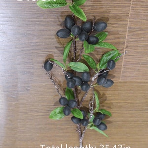 May include: Black artificial olive branch with green leaves and black berries. Total length: 35.43in.