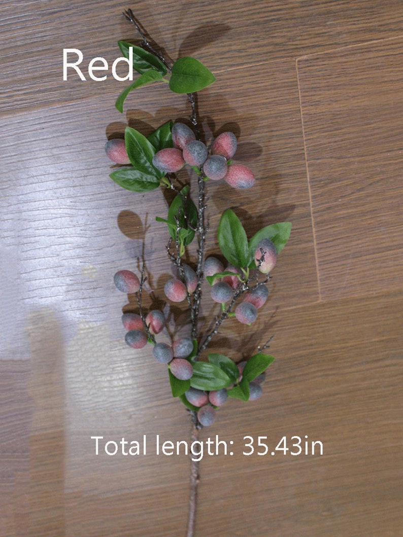 May include: A red berry sprig with green leaves and a total length of 35.43 inches. The berries are a dark blue with a red hue.