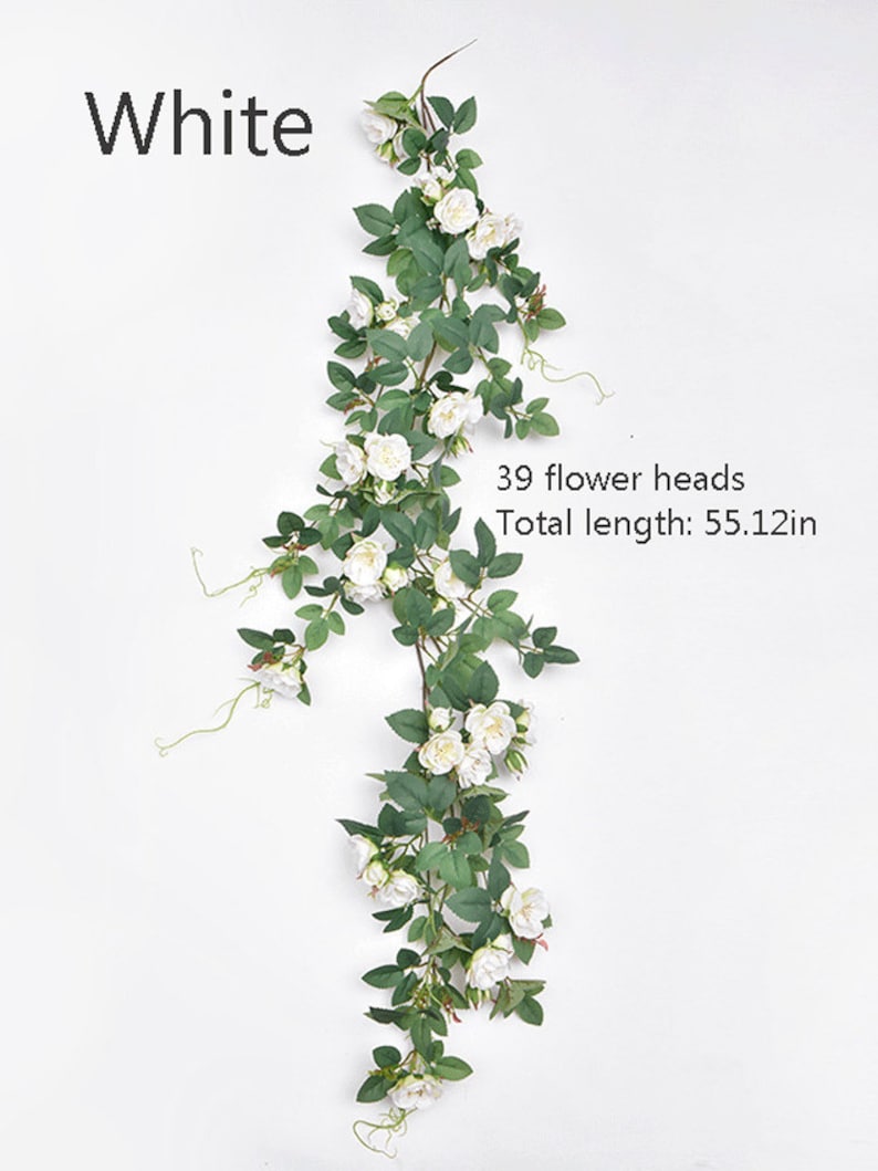 Puede incluir: Enredadera artificial de rosas blancas con 39 cabezas de flores y una longitud total de 140 cm.
